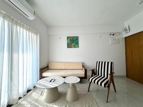 Sainagar Apartment | Boutique 1BHK Pool Retreat with Modern Amenities and Private Balcony