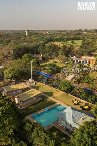 Gurugram Villa | StayVista at Kaimalgarh Aravalli Estate with Private Pool & Lake