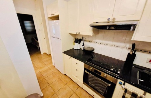 Universal Apartment | A spacious apartment with one bedroom and a living room.