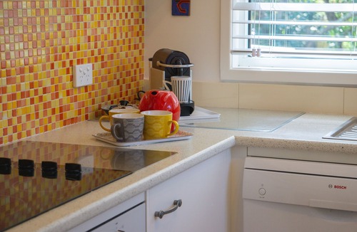 Macmasters Beach House | Castaway | Cosy-up by the fire | Opposite beach path | Pet friendly
