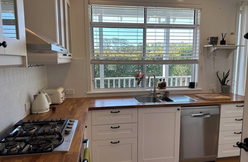 Mullaway Apartment | Dog friendly apartment close to beaches. Own private yard, garden and 2 decks.