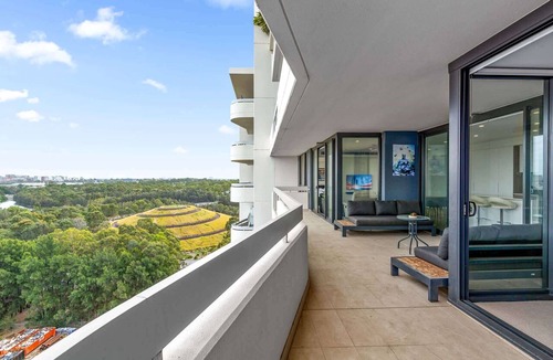 Lidcombe Apartment | Luxe 2-Bed: Modern Interiors, Balcony & BBQ Area