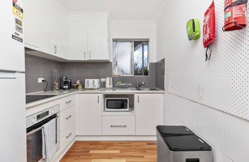 Kooringal Apartment | Patio with BBQ | Festoon Lights | Full Kitchen