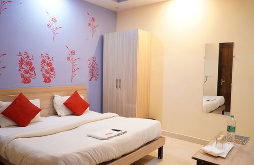South West Hotel | Roomshala 002 Rose Residency