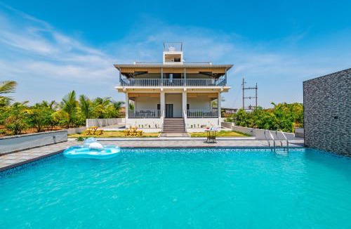 Nashik Villa | SaffronStays Mango Lakeview Villa - 3BR pool villa amid mango farms with Gangapur Dam views, deck & games