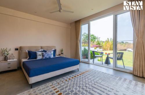 Anjaneri Villa | StayVista at Vayu Farm with BBQ, Bonfire & Lake View
