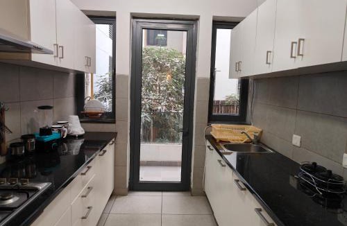 Sector 58 Apartment | Stylish 2BHK Ground Floor Apartment with high speed WiFi and Kitchen near Golf course road