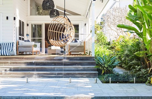 Palm Beach House | This home matches quaint beachside charm with luxurious comfort.