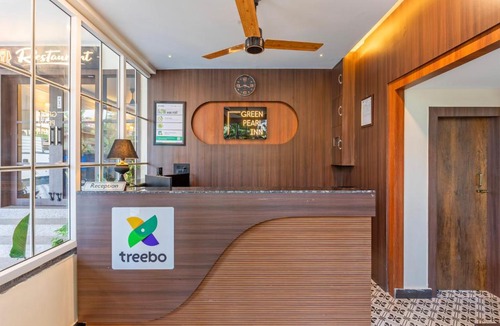 Beltola Hotel | Treebo Green Pearl Inn