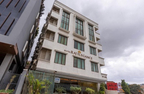 Nagavara Hotel | Treebo Premium Raj Elegance Manyata Tech Park