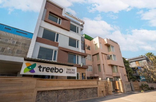 Jharsa Village Hotel | Treebo Twin Tree Residency