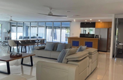 Mermaid Waters House | Waterfront retreat with jetty, pool, waterslide and luxury comfort.