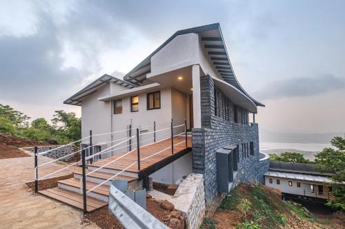 SaffronStays Ahilya Waters - 3BR Pawna villa, infinity pool, 270 terrace views, bonfire & AD-featured estate
