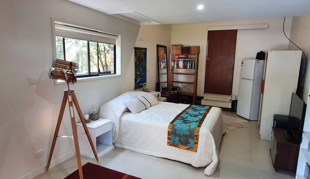 Studio style self contained room, steps to the beach.