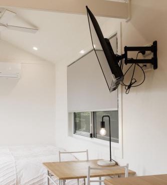 Sweet beautiful TINY HOME with pool and 2 minute drive to the beach