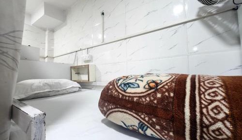 Single Bed in Dormitory Room
