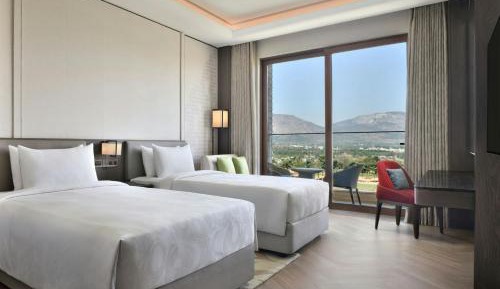 Signature Queen Room with two queen beds with a private Balcony and complimentary evening local tea experience