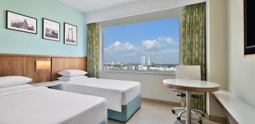 Executive Twin Room - Happy Hours (1+1 IMFL - 4 PM to 8 PM) at Vertex