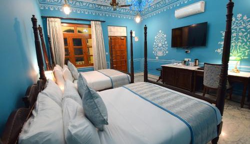 Deluxe Suite: Complimentary use of swimming pool, kids stay complimentary, secure gated parking, free games, activities at the farm resort, and a dedicated travel desk to assist with local sightseeing tours & memorable travel experience