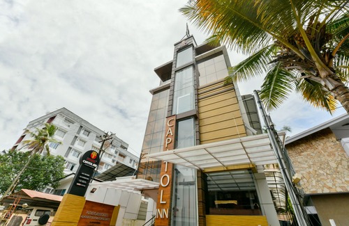 Kaloor Hotel | OYO 18604 Puthens Capitol Inn